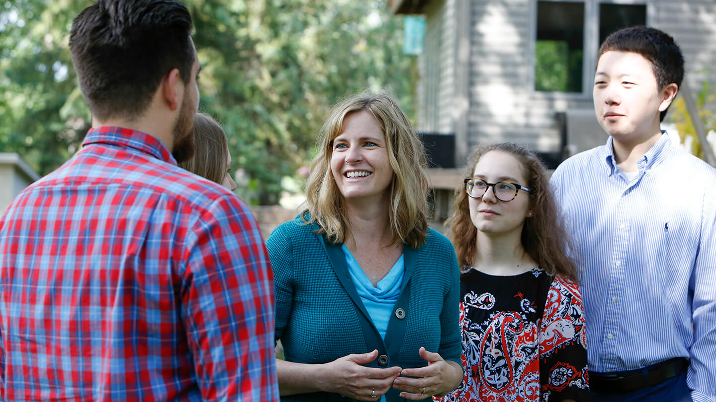 Kelly Moller talks to neighbors