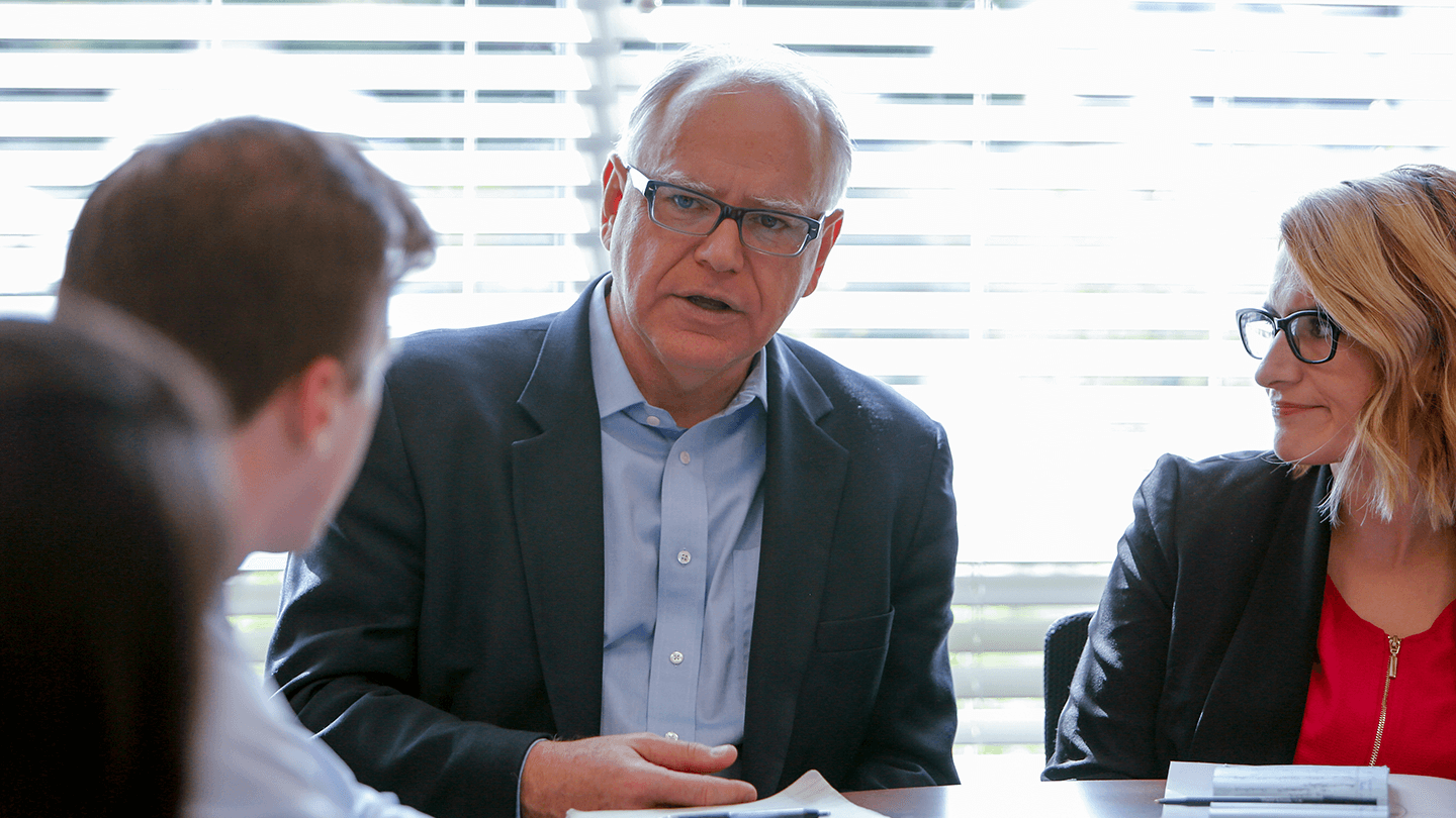 Tim Walz and Peggy Flanagan talk with constituents