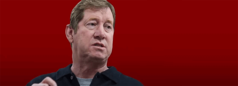 Jason Lewis on a red background