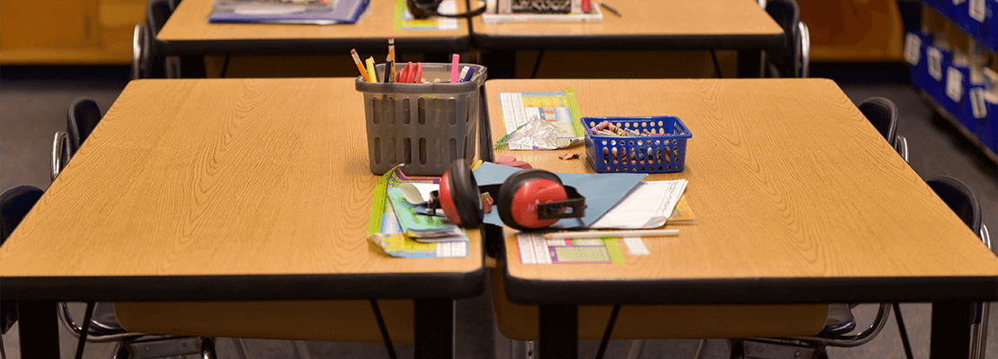 A row of desks in a Minnesota classroom