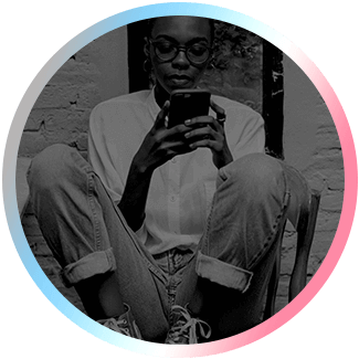 Image of a person sitting down looking at a mobile phone